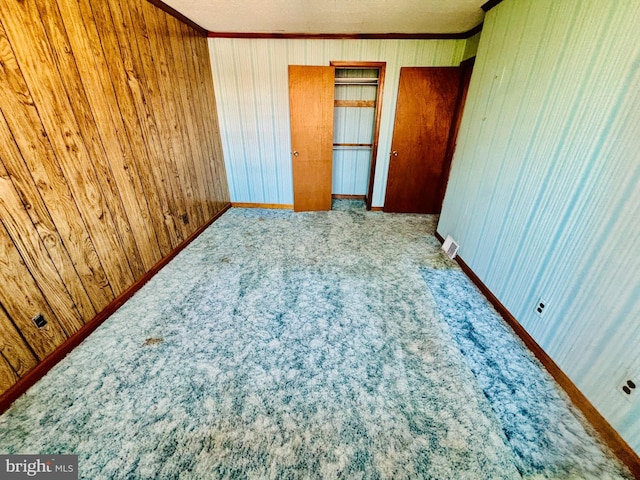 2633 Levick St, Philadelphia, PA 19149 - unfurnished bedroom with carpet floors, crown molding, and wooden walls