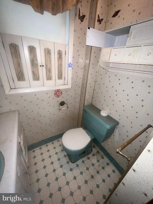 bathroom featuring tile patterned floors and toilet