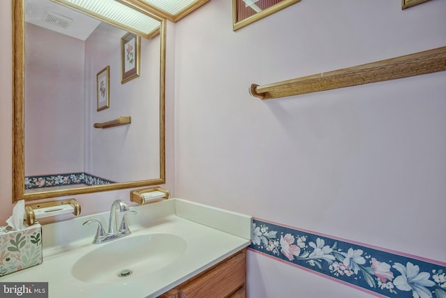 bathroom featuring vanity and visible vents