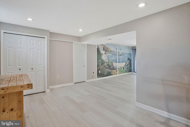 interior space with light wood-style floors, baseboards, and recessed lighting