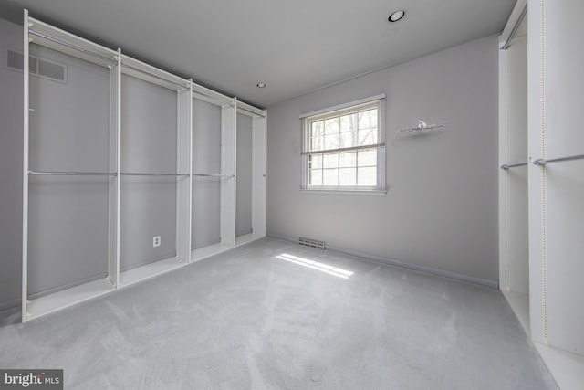 unfurnished bedroom with visible vents and carpet floors