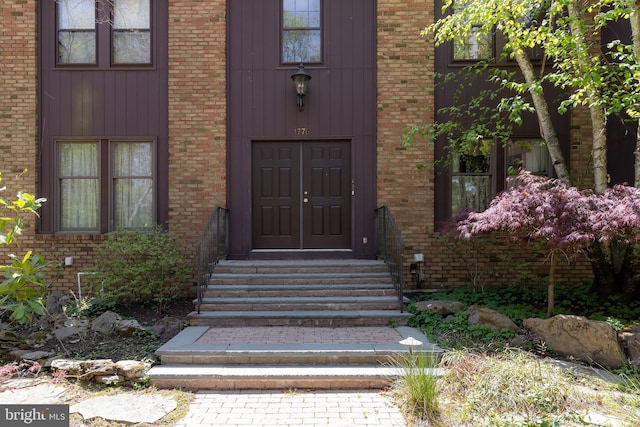 entrance to property with brick siding
