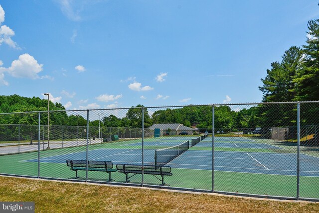 view of sport court with fence