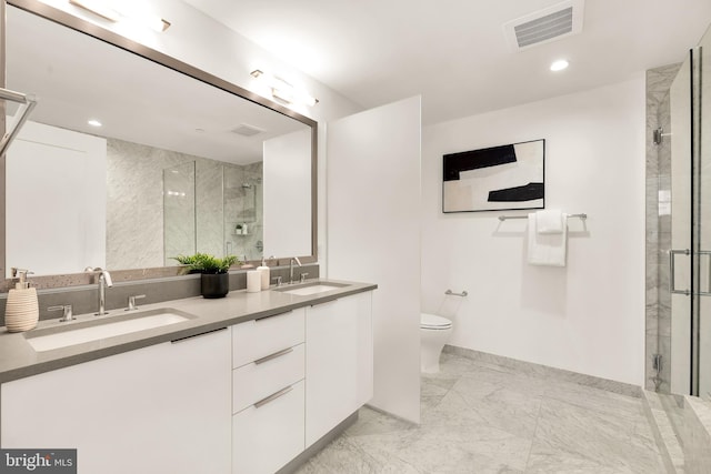 full bathroom featuring a shower stall, marble finish flooring, double vanity, toilet, and recessed lighting