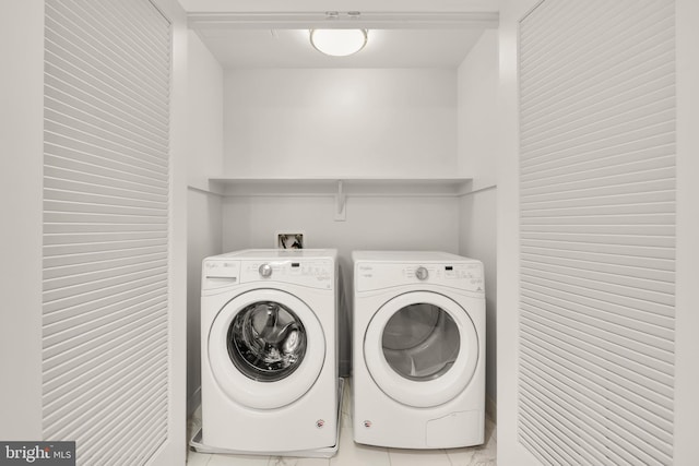 laundry room featuring independent washer and dryer