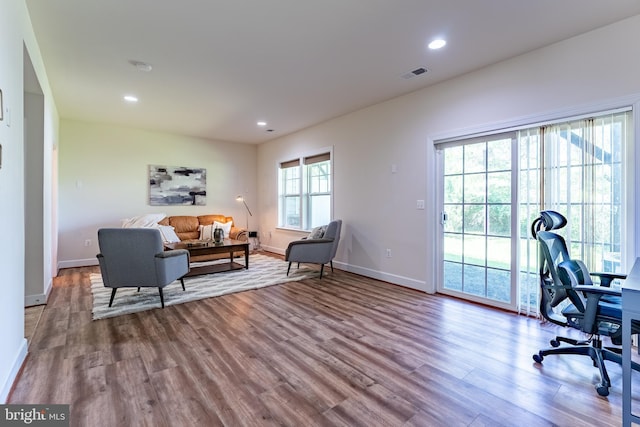 home office with recessed lighting, baseboards, visible vents, and wood finished floors
