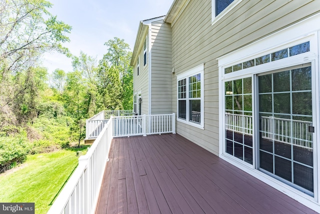 deck featuring a lawn