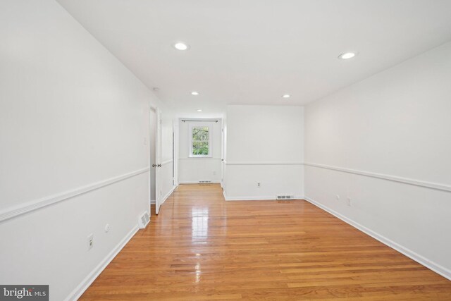 empty room with recessed lighting, visible vents, baseboards, and light wood-style floors