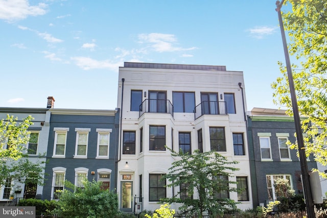 multi unit property featuring a balcony