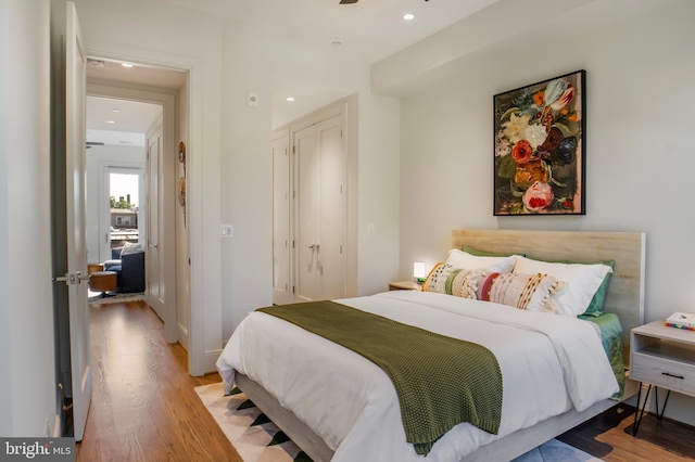 bedroom featuring recessed lighting and wood finished floors