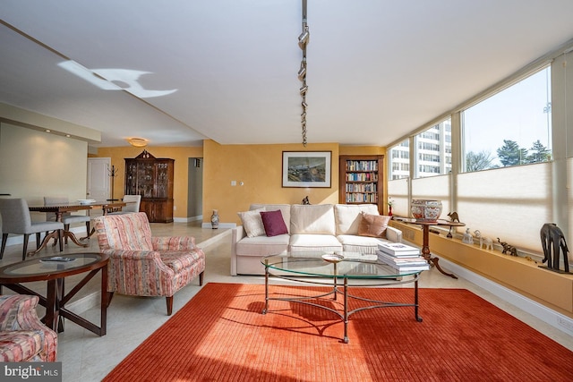 living room featuring baseboards