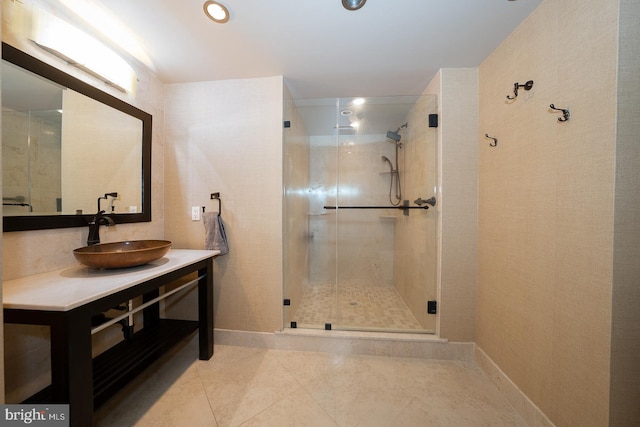 bathroom featuring vanity, baseboards, recessed lighting, tile patterned floors, and a stall shower