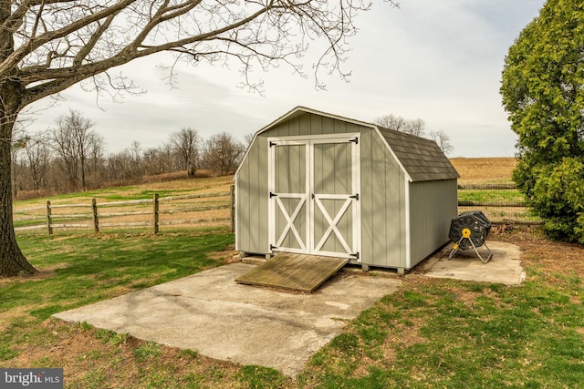 view of shed with fence