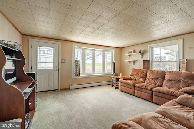 living area with crown molding, a baseboard radiator, plenty of natural light, and carpet flooring