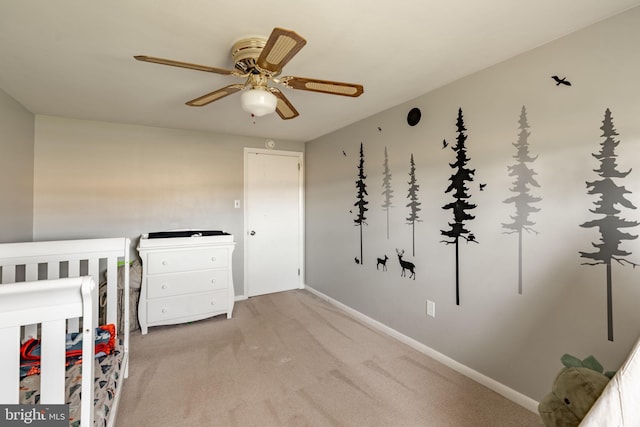 unfurnished bedroom featuring baseboards, ceiling fan, and carpet flooring