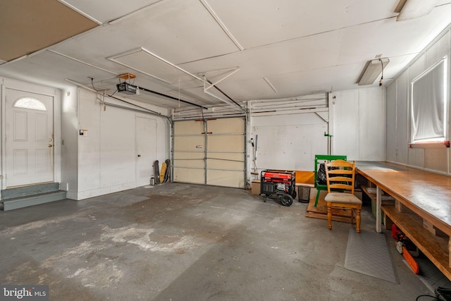 garage featuring a workshop area and a garage door opener