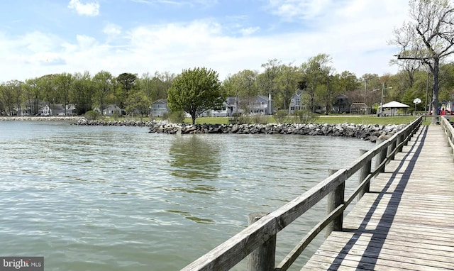 view of dock with a water view and a gazebo