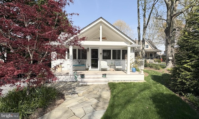 rear view of house with a lawn