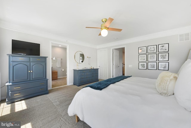 bedroom with light colored carpet, a ceiling fan, ensuite bathroom, visible vents, and ornamental molding