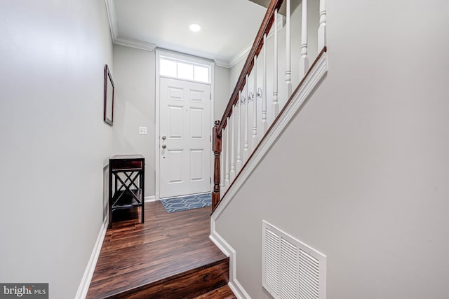 42880 Conrad Ter, Chantilly, VA 20152 - foyer featuring visible vents, crown molding, baseboards, stairway, and dark wood-type flooring