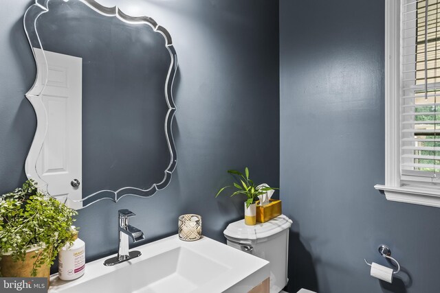 half bath with toilet and vanity