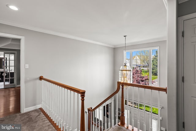 staircase with crown molding, recessed lighting, wood finished floors, and baseboards