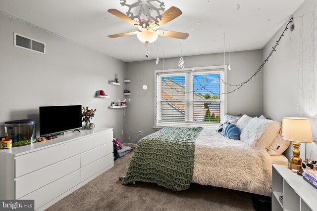 bedroom with visible vents, ceiling fan, and carpet flooring