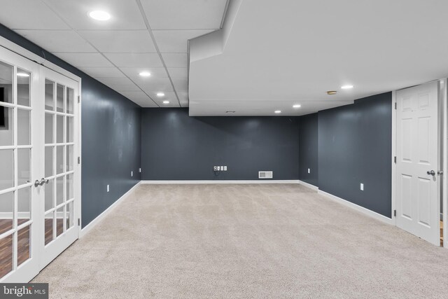 finished basement with carpet flooring, visible vents, baseboards, recessed lighting, and french doors
