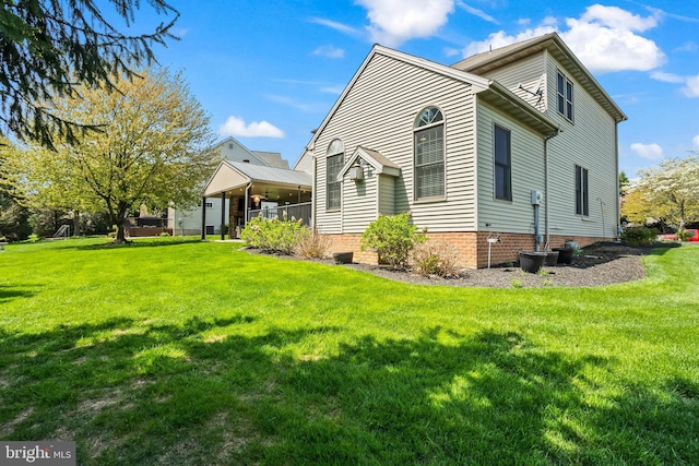 view of home's exterior featuring a yard