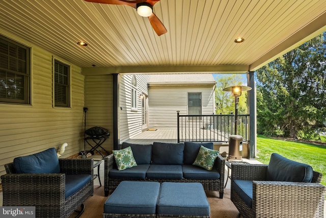 view of patio / terrace featuring outdoor lounge area, a ceiling fan, and a wooden deck