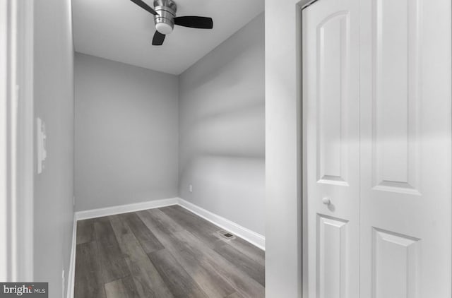 3420 E Baltimore St, Baltimore, MD 21224 - spare room featuring baseboards, visible vents, a ceiling fan, and dark wood-type flooring