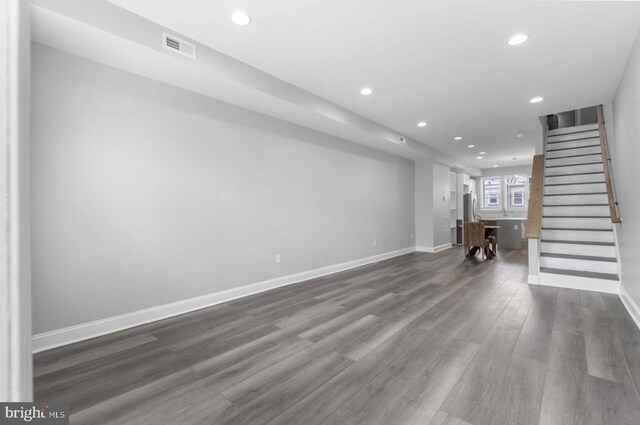 3420 E Baltimore St, Baltimore, MD 21224 - unfurnished living room with recessed lighting, baseboards, dark wood finished floors, and stairs