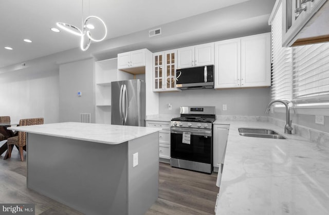 3420 E Baltimore St, Baltimore, MD 21224 - kitchen with visible vents, appliances with stainless steel finishes, a kitchen island, and a sink