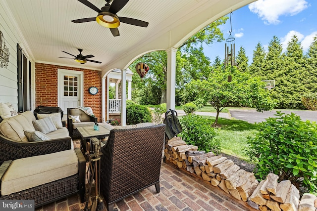 view of patio / terrace with ceiling fan and a porch