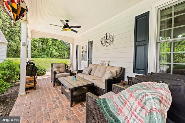 view of patio with outdoor lounge area and a ceiling fan