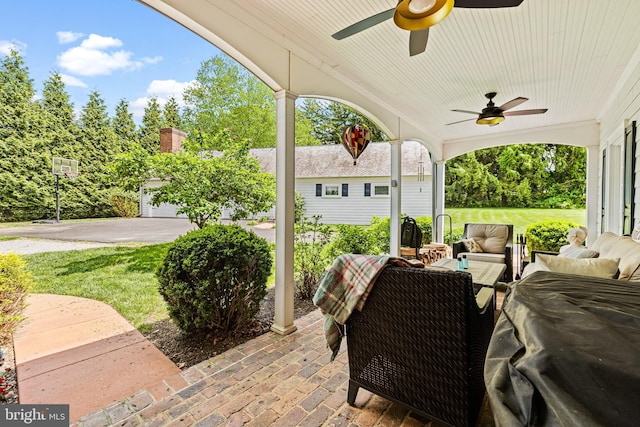 view of patio with ceiling fan and an outdoor hangout area