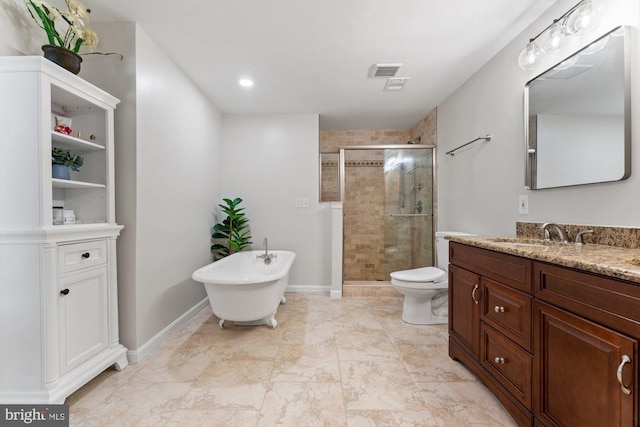full bathroom with vanity, a freestanding tub, toilet, a stall shower, and visible vents