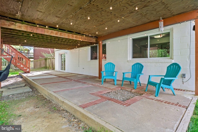 view of patio featuring stairway