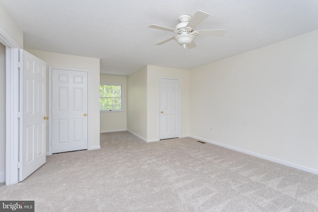 275 Wood Rise Ln, Winchester, VA 22602 - unfurnished bedroom with baseboards, visible vents, ceiling fan, and carpet