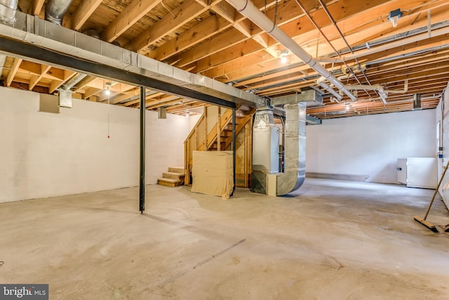 275 Wood Rise Ln, Winchester, VA 22602 - unfinished basement featuring heating unit, fridge, and stairway