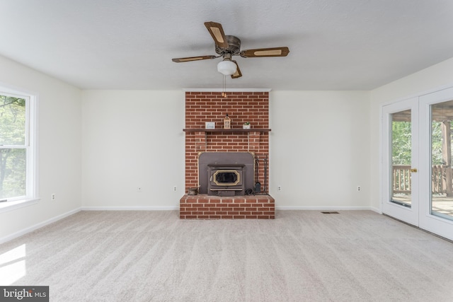 275 Wood Rise Ln, Winchester, VA 22602 - unfurnished living room featuring visible vents, baseboards, ceiling fan, and a healthy amount of sunlight