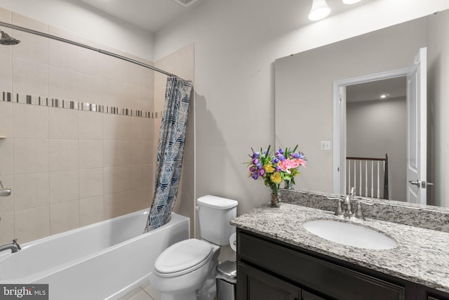 bathroom with vanity, shower / bath combination with curtain, and toilet