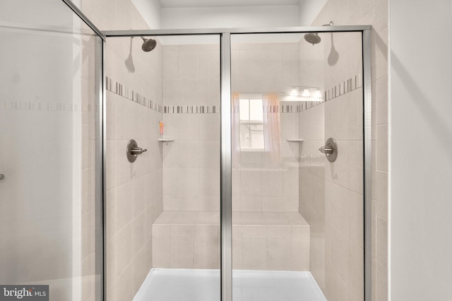 full bathroom featuring a stall shower