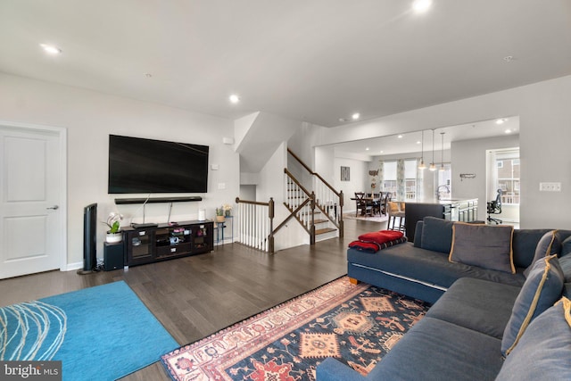 living area with stairway, recessed lighting, and wood finished floors
