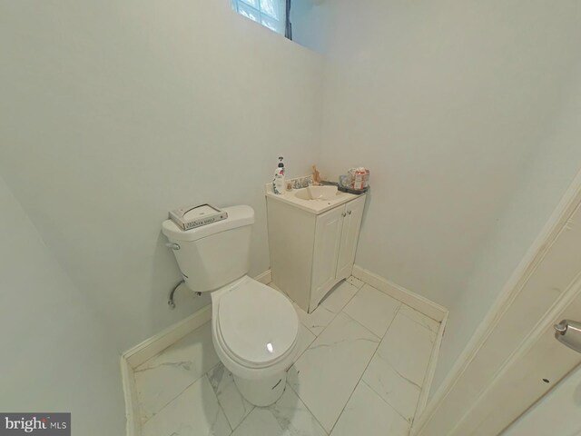 2113 N 17th St, Philadelphia, PA 19121 - bathroom with toilet, baseboards, marble finish floor, and vanity
