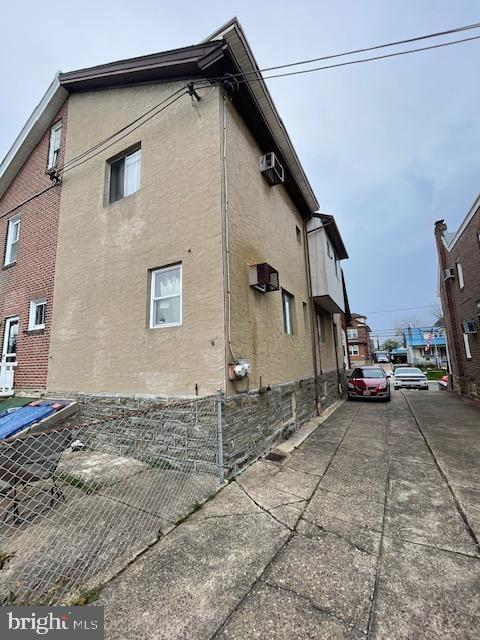 view of side of home with stucco siding