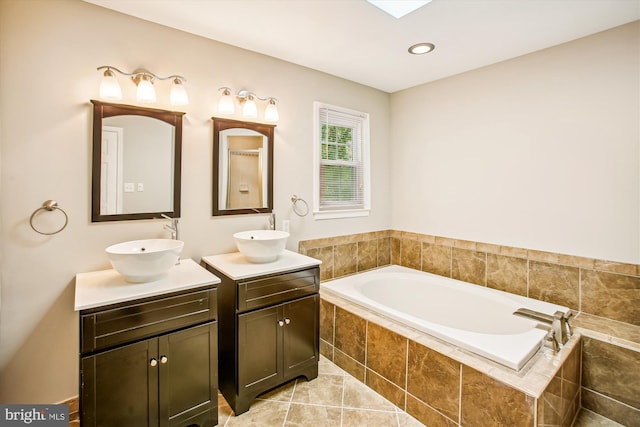 21130 Haystack Ct, Ashburn, VA 20147 - full bath featuring two vanities, a bath, and recessed lighting