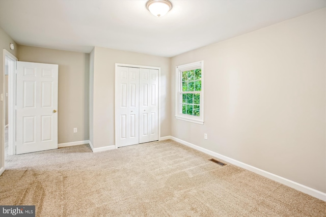 21130 Haystack Ct, Ashburn, VA 20147 - unfurnished bedroom featuring baseboards, a closet, and carpet