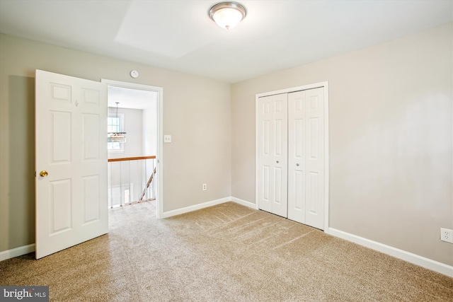 21130 Haystack Ct, Ashburn, VA 20147 - unfurnished bedroom with carpet, baseboards, and a closet