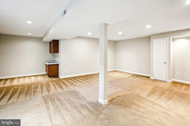 21130 Haystack Ct, Ashburn, VA 20147 - finished below grade area with light carpet, baseboards, recessed lighting, and a sink